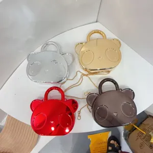 Cute glossy bear metallic handbag for kids, stylish mini crossbody coin purse set detail.