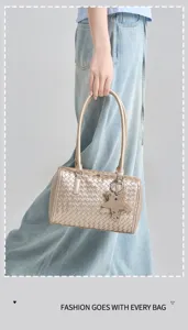 Woven shoulder bag with star charm, metallic finish pillow handbag for women daily commute.