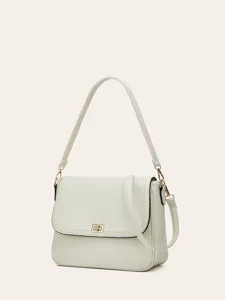 Detailed view of a chic off-white leather shoulder bag with metal lock and elegant strap.