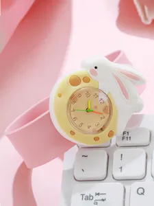 Cute cartoon rabbit children silicone slap watch detail shot featuring pink band and dial.