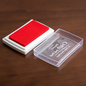 Red stamp ink pad with clear plastic lid for fabric wood and paper crafting stamping projects