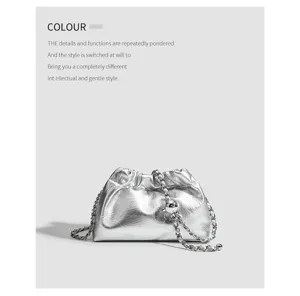 Silver metallic gathered cloud bag with stylish chain strap and chic metal ball adjuster detail.