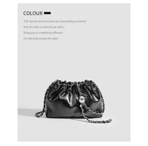Black wrinkled cloud bag with metal chain strap, chic hobo shoulder bag for women.