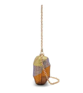 Detailed side view of the colorful rhinestone evening clutch bag with gold chain strap.