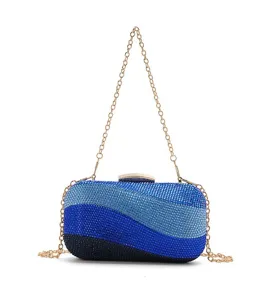 Detailed close-up view of the luxury gradient blue rhinestone evening clutch with gold chain strap.