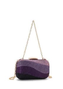 Close-up detail of purple gradient rhinestone evening clutch with luxury gold chain strap.