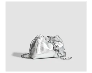 Silver metallic crinkled cloud bag with a stylish chain strap for women daily commuting.