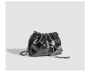 Black crinkled leather cloud bag detail, chic chain strap and metal ball design.