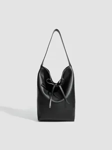 Bolso cubo negro de piel suave para mujer, elegante bolso de hombro con cordón ajustable.