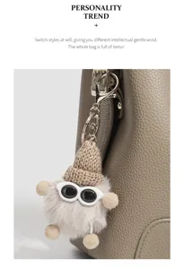 Stylish women bucket bag detail view, featuring a cute fluffy doll pendant, large capacity.