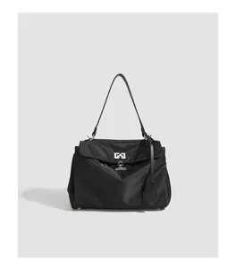 Black nylon waterproof shoulder bag with silver lock clasp, chic underarm tote handbag for women.