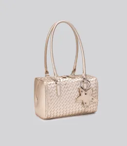 Gold woven leather handbag detail showcasing intricate weave pattern and star charm.