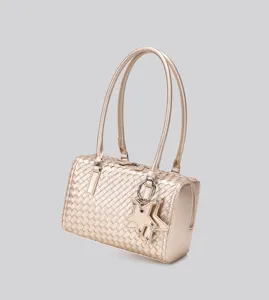 Metallic gold woven shoulder bag for women, chic pillow handbag with star charm decor.