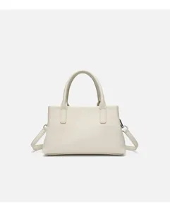 Minimalist off-white pebbled leather handbag detail, featuring top handles and strap rings.