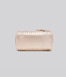 Detail view of the gold woven leather pillow shoulder bag showcasing its unique texture.