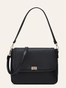Detailed view of black leather crossbody bag featuring gold hardware and classic flap design.