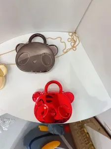Cute glossy bear hard shell crossbody handbag for kids, stylish mini coin purse accessories.