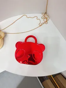 Glossy red bear handbag for kids, cute mini crossbody shoulder bag with chain strap.