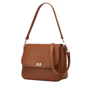 Brown leather shoulder bag detail, elegant retro design with golden lock and strap.