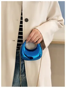 Glossy metallic blue mini crossbody handbag with chic chain strap for women fashion style.