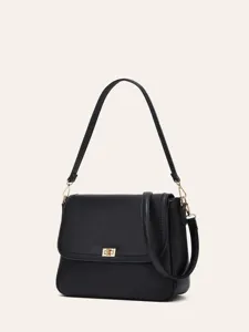 Black leather shoulder bag for women, versatile retro crossbody purse with elegant gold hardware.