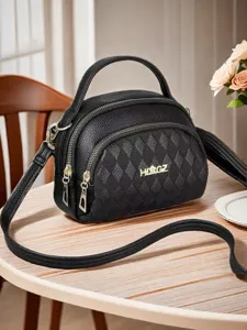 Stylish black leather top-handle crossbody bag with multi-layer zippers for women.