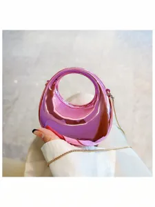 Glossy pink mini handbag with round handle and chain strap, trendy fashion cross-body bag.