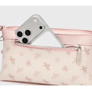 Detail view of the pink shoulder crossbody bag zipper pocket showing storage capacity.