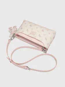 Stylish women's shoulder bag with chic pegasus pattern, pink trim, and cute bear charm.