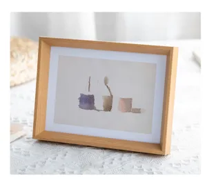 Wooden photo frame detail showcasing natural wood grain texture and tabletop display.