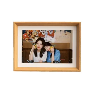 Wooden photo frame for tabletop display, natural wood finish with white mat for home decor.