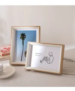 Modern minimalist resin photo frame detail, wooden texture desktop picture frame setup.