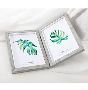 Wooden double photo frame detail shot, rustic grey finish with botanical leaf art print.