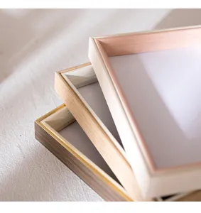 Minimalist photo frame detail view, showing elegant stacked design for modern home decor styling.