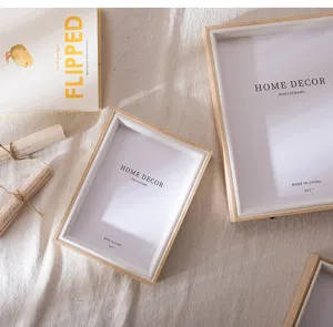 Detailed view of minimalist wooden 5x7 photo frame with natural texture for home decor.