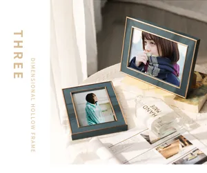 Modern minimalist dark green photo frame tabletop detail display, elegant gold trim decor.
