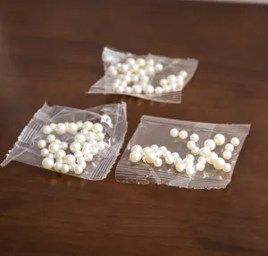 Mixed white simulation pearls for DIY resin craft, small transparent bags pack detail.