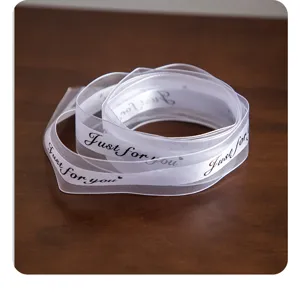 White ribbon roll with Just for you print, perfect for DIY crafts and gift wrapping decoration.