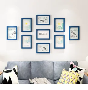 Wooden gallery wall photo frame set with art prints for living room home decor display.