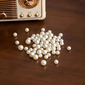 Mixed white faux pearls bulk for DIY resin crafts and jewelry making accessories setup.