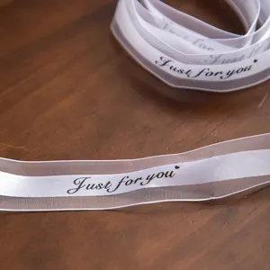White sheer decorative ribbon with black Just for you text, perfect for gift wrapping and DIY crafts.