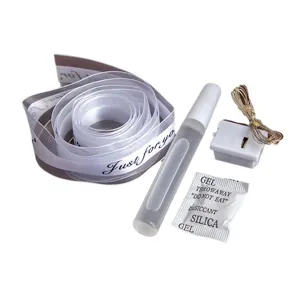 DIY craft accessories set with ribbon, glue, and LED fairy lights for handmade projects.