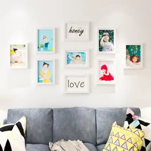 Modern white picture frames photo wall set for living room home decor and kids room display.