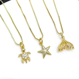 Mooie verguld maritieme hanger halsketting met schildpad, zeester en zeemeerminstaart.
