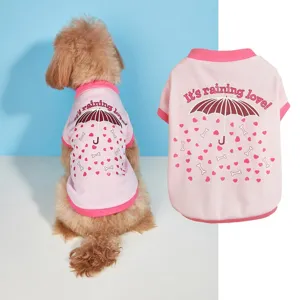 Detailed view of cute pink pet t-shirt with umbrella print, ideal for small dogs daily wear.
