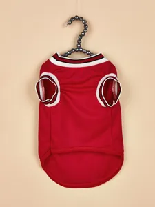 Detailed close-up of red mesh pet basketball jersey with black white striped ribbed collar.