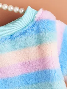 Closeup detail of colorful striped fluffy pet sweater with ribbed collar, soft warm fabric.