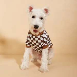 Detailed view of the brown and white checkerboard pet sweater, cute cozy dog apparel.