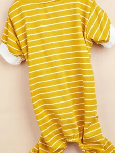 Close-up detail of yellow and white striped dog onesie, soft cotton pet pajamas for small dogs.