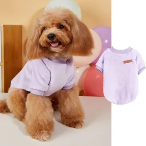 Pet fleece sweatshirt detail showing soft purple fabric texture and classic leather brand patch label.